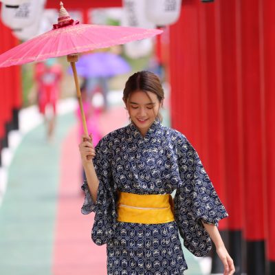 woman-kimono-holding-umbrella-walking-into-shrine-japanese-garden_35752-2253